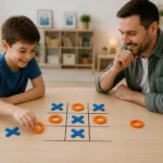 Pere et fils jouant au morpion